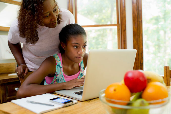 Child learning at home with mom