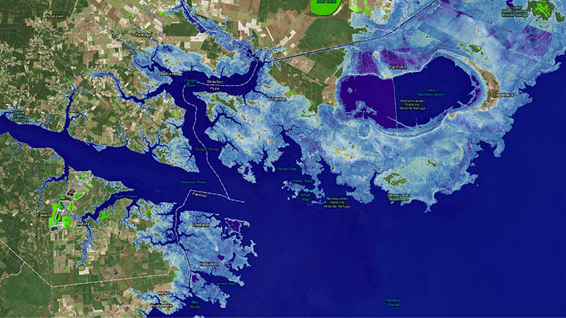 After: A one-meter rise in sea levels would reshape many U.S. coastlines, including this section of North Carolina’s coast. Blue regions show areas submerged by water. Many scientists expect that sea levels will rise by a meter by 2100.