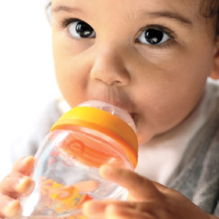 baby drinks from bottle