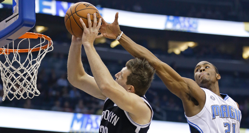 players playing basketball