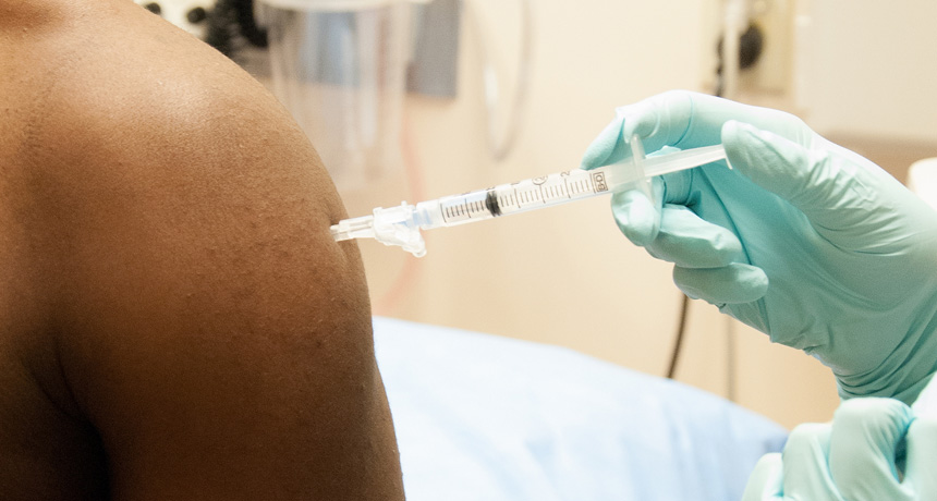 Ebola trial participant getting vaccinated