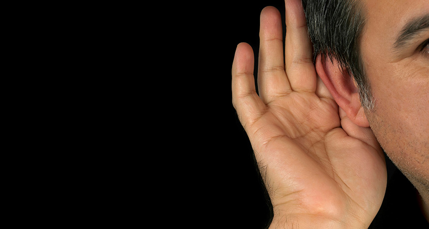 person cupping ear