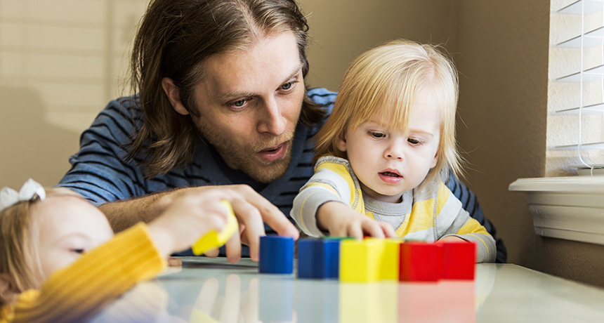 parent and kids play with toys
