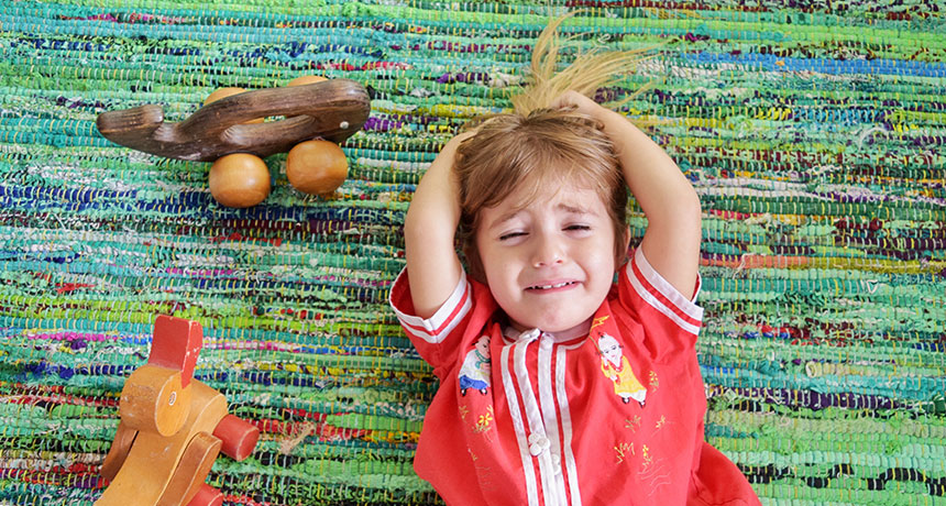 toddler crying on floor