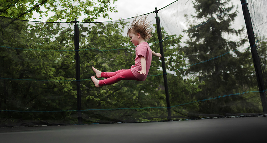little girl on a trampoline