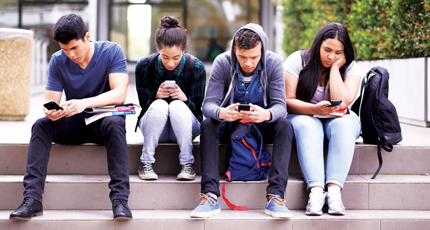 young adults on smartphones
