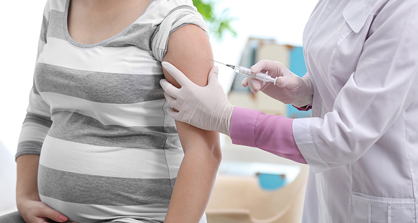 pregnant woman getting a vaccine