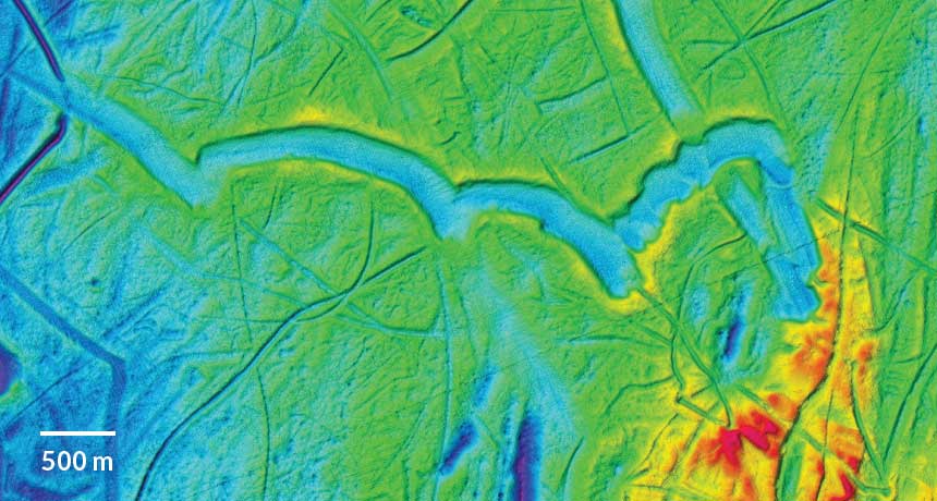 false-color map of seafloor showing tracks of icebergs
