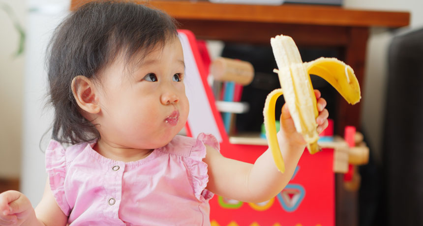 baby eating a banana
