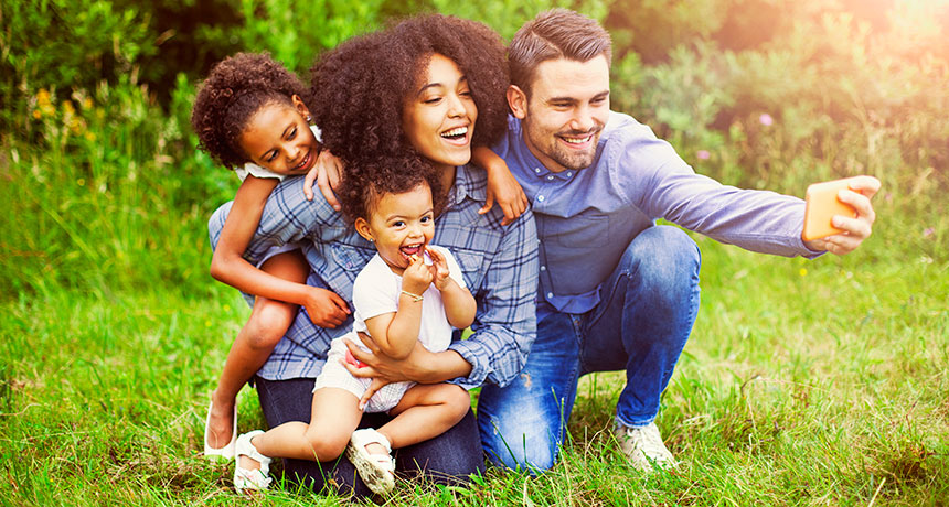 picture of family taking selfies