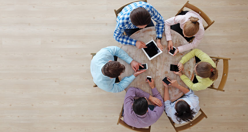 circle of people on personal electronic devices