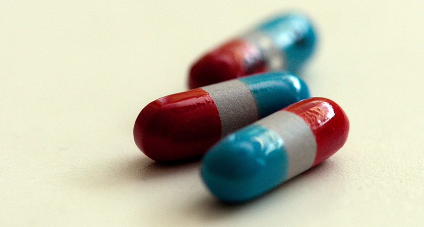 red, gray and blue pill capsules