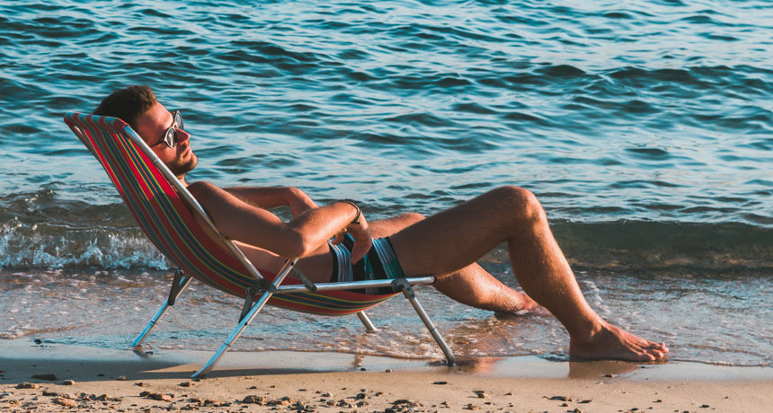 person sunbathing on a beach
