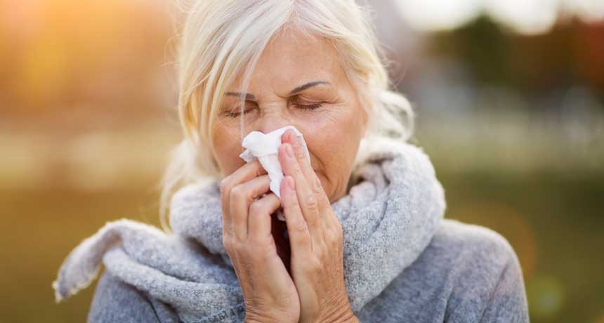 woman sneezing