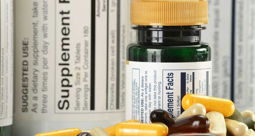 an image of a pill bottle and a pile of supplements in front of nutritional information label