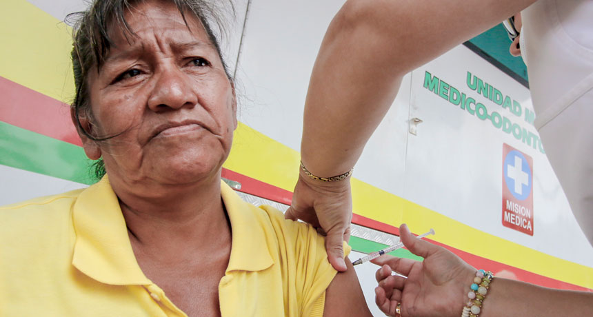 woman receiving measles vaccine