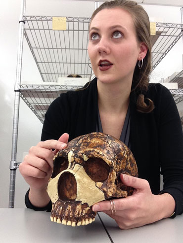 a photo of Kimberly Foecke holding a Neandertal skull