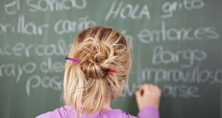 girl writing on chalkboard