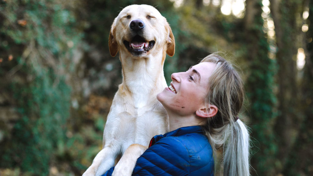 woman holding dog