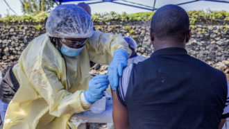 Nurse vaccinating someone in Goma