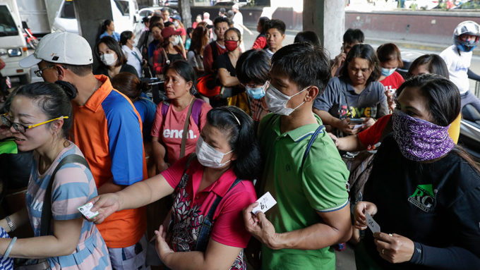 people buying face masks in Manila