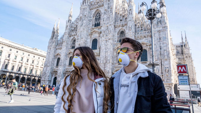 people wearing masks in Milan