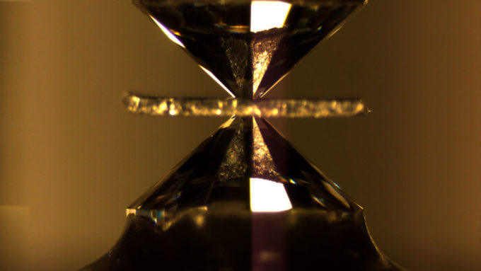 a superconductor being squeezed between two diamonds