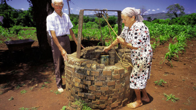 people at a well in Misiones, Argentina