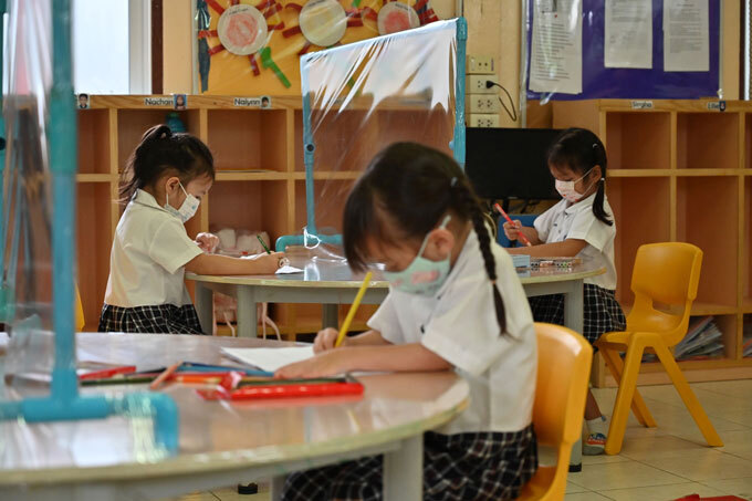 children at a Thai school with partitions