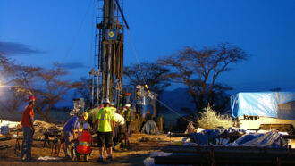 workers standing at a drilling site in Kenya's Koora basin