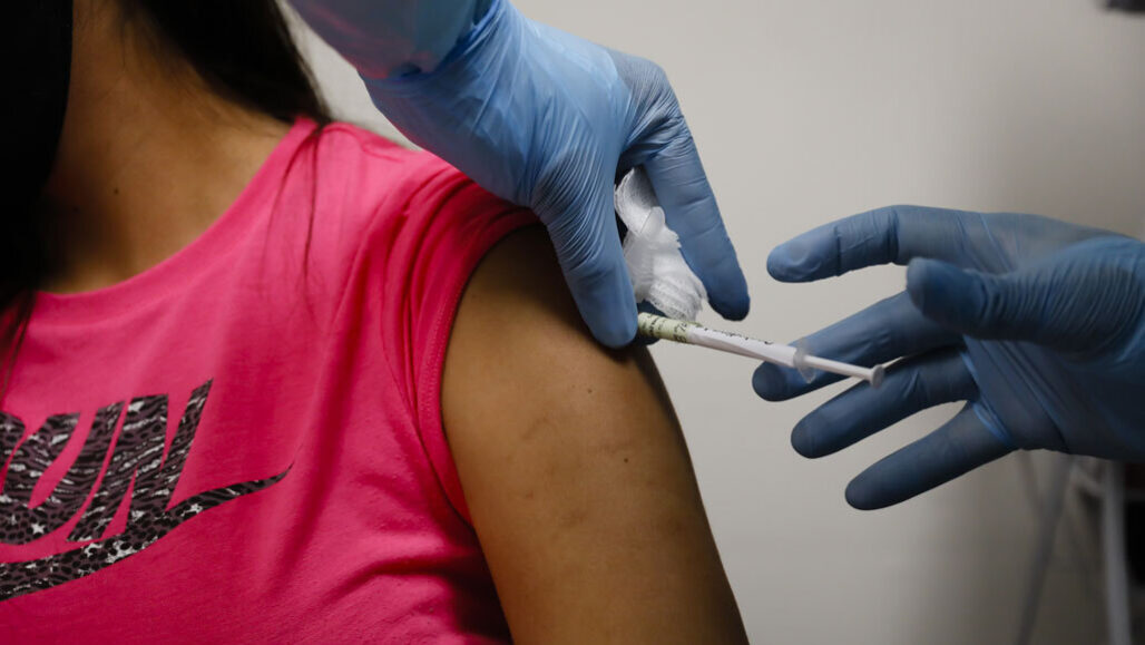 volunteer receives vaccine in Pfizer and BioNTech’s trial