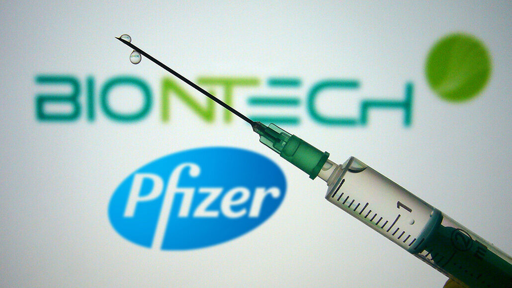 photo of a syringe with the Pfizer and BioNTech logos in the background