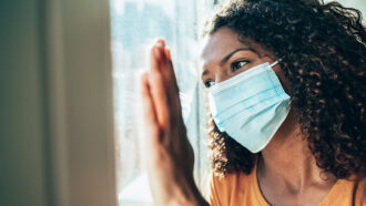 woman inside wearing mask