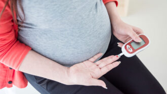 pregnant person testing blood sugar
