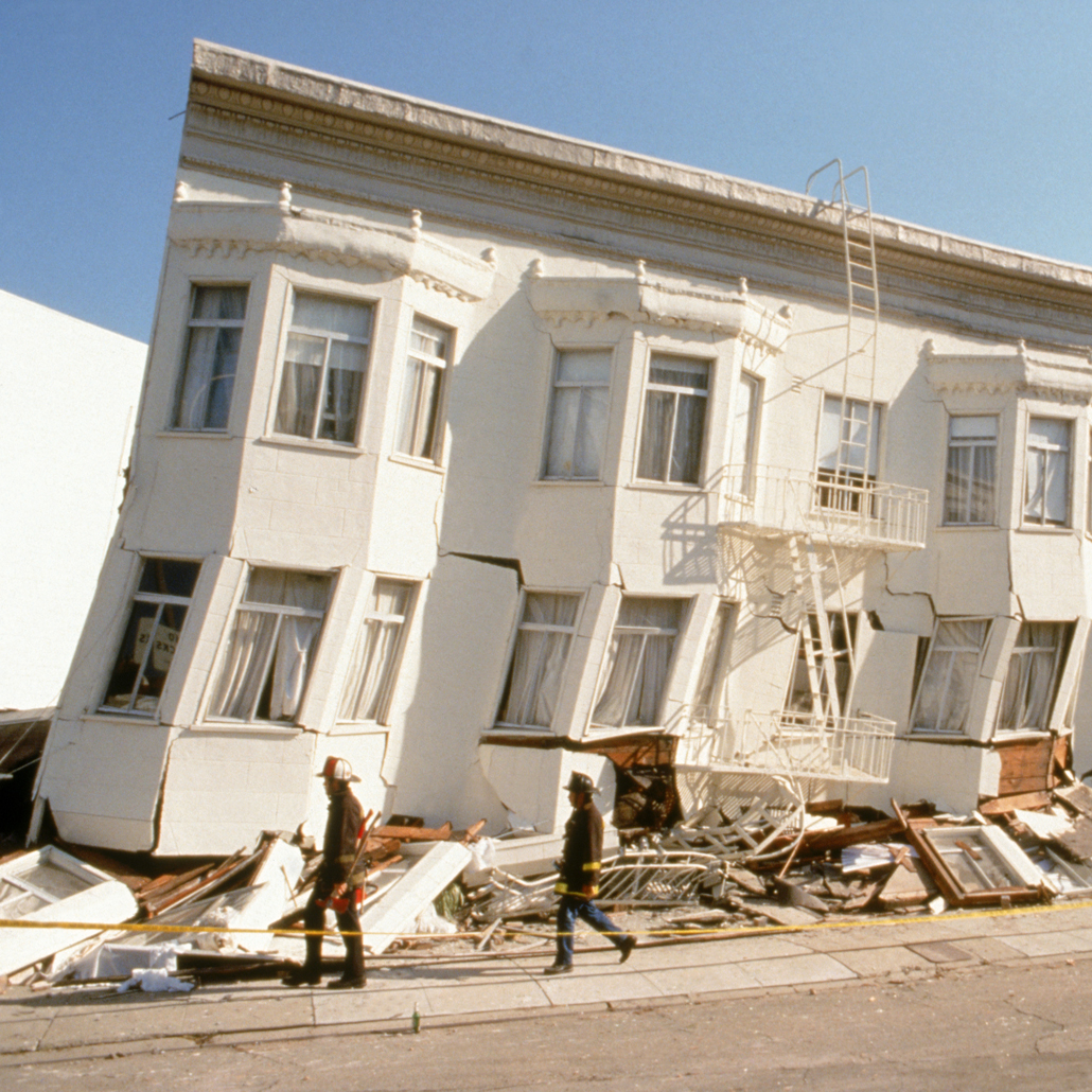block of row houses off kilter from earthquake damage