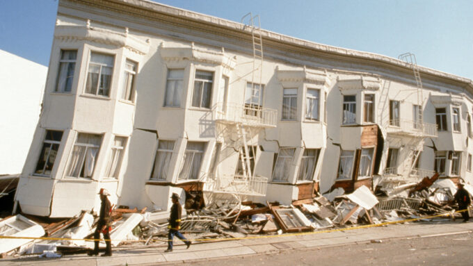 block of row houses off kilter from earthquake damage