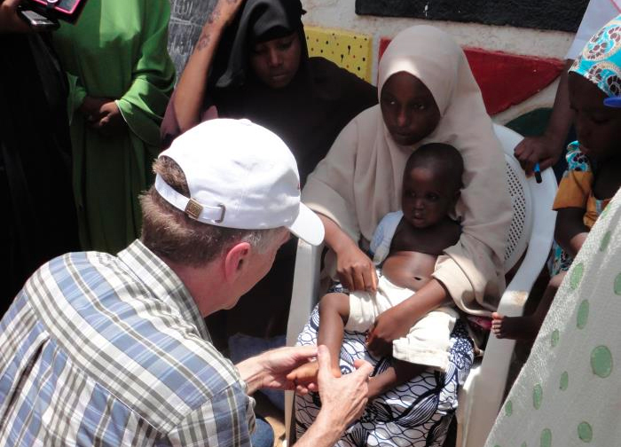 doctor examines child in Nigeria