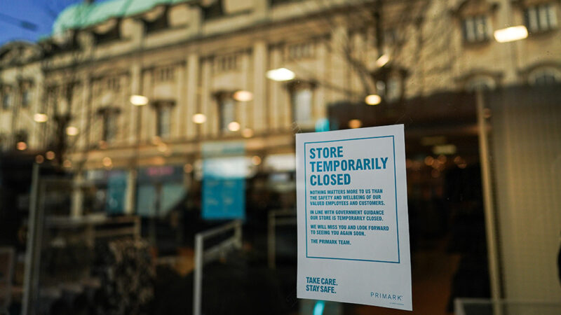 temporary closed sign in a store window