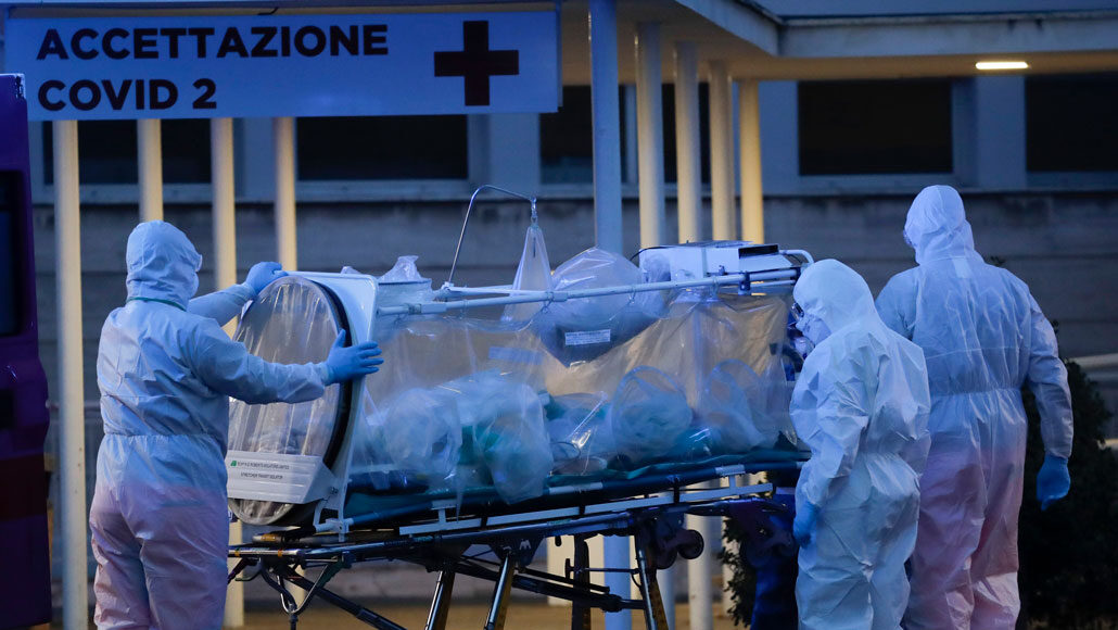 medical staff transporting a patient at a hospital in Rome