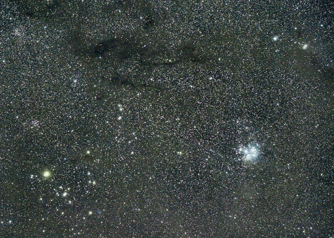 interstellar cloud TMC-1 with the pleiades cluster in the background