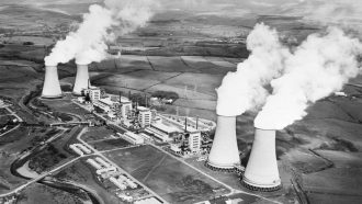 black and white image of Calder Hall power plant smokestacks