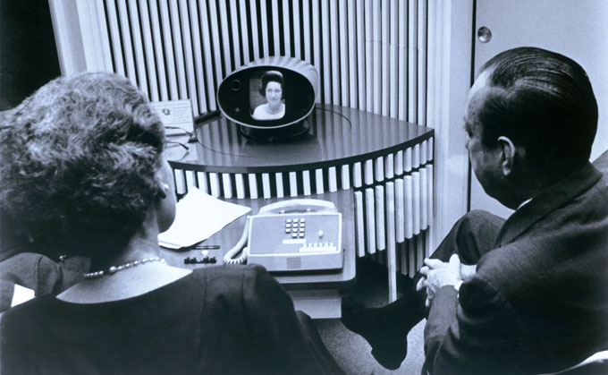 man and woman watching Lady Bird Johnson on a prototype AT&T videophone