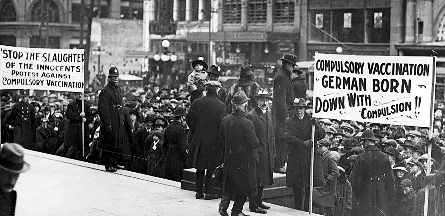a black and white photo showing an anti-vaccination demonstration