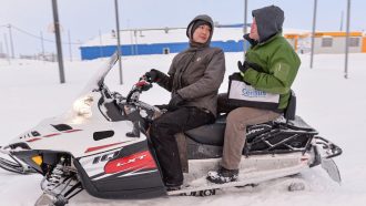 two people on a snowmobile