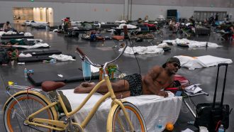 Portland residents cooling off in the Oregon Convention Center