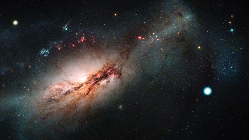 electron-capture supernova, shown as white dot, in space