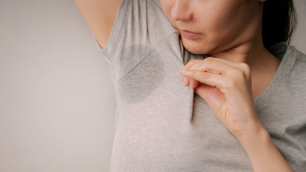 Woman with sweat stain