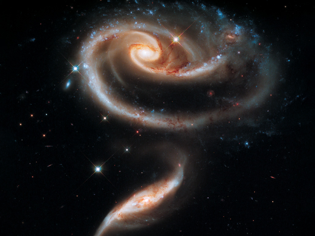 two spiral galaxies that appear connected