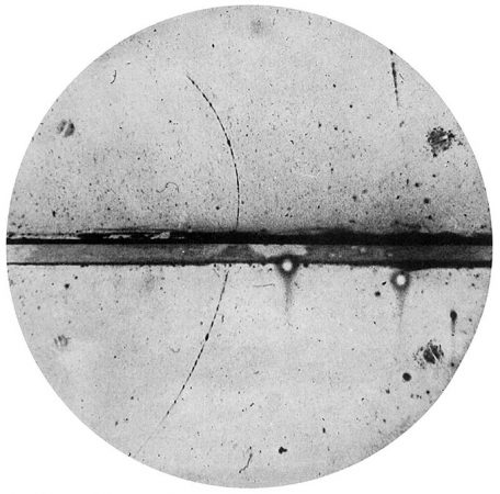 black and white image of positron particle track