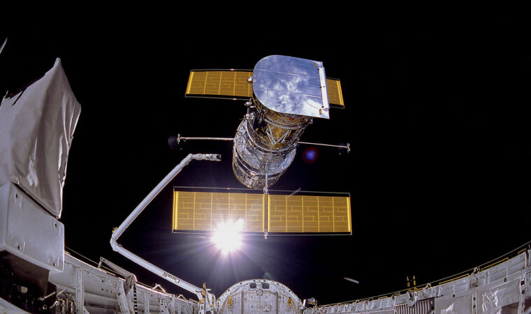 photo of the Hubble space telescope being released in space